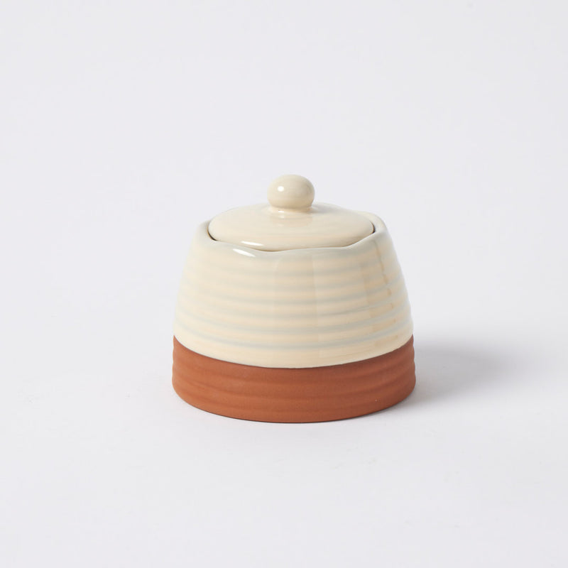 Grove Canister crafted from terracotta in a soft oatmeal finish