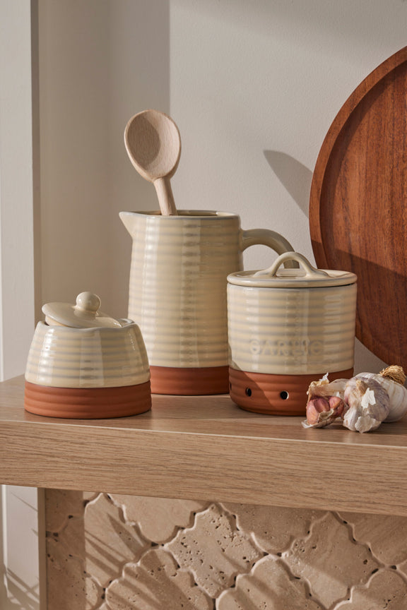 Grove Canister crafted from terracotta in a soft oatmeal finish