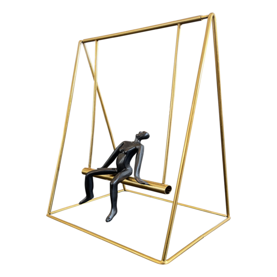 Small Person Sitting on a Swing 